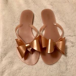 Rose gold flip flops